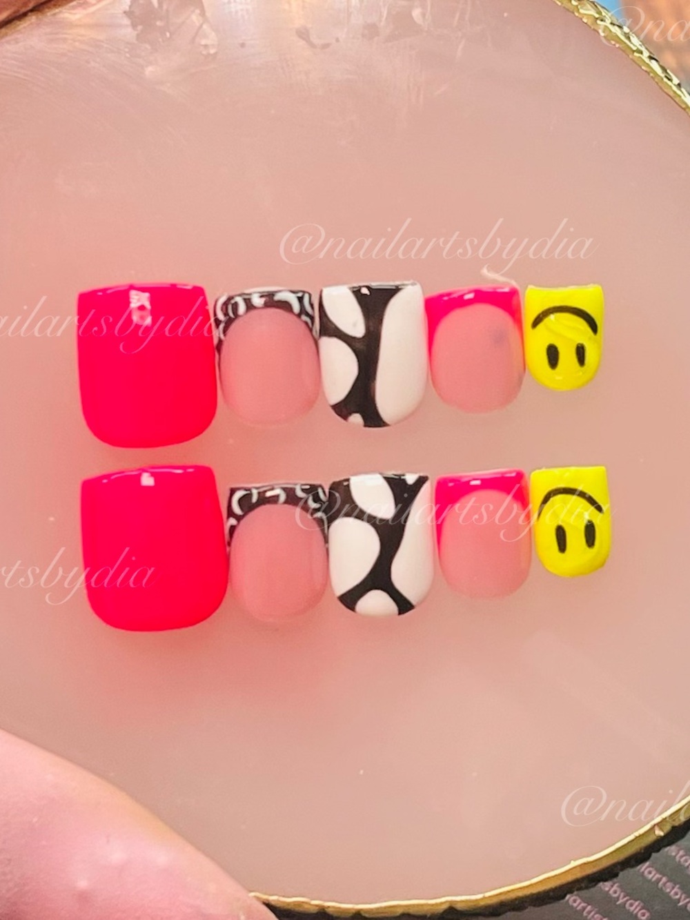 Nail Art - Pink, white/black abstract swirl, and yellow smiley face designs